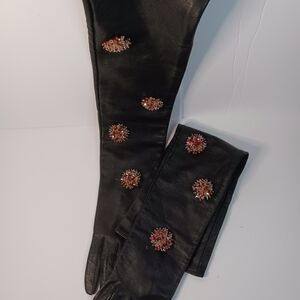 Black Leather Gloves with Red Embellishments